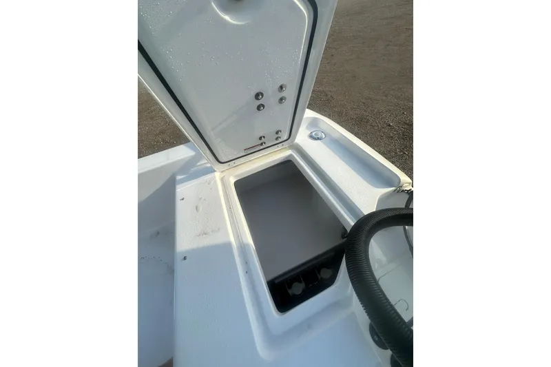 Slide: The Image of Open storage compartment on 2026 Action Craft 22 Bay boat, showcasing interior space. - 49
