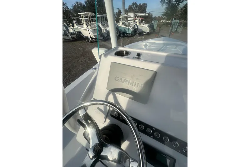 Slide: The Image of 2026 Action Craft 22 Bay boat dashboard with Garmin navigation system. - 53
