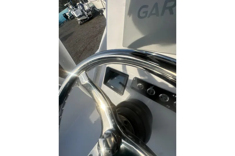 Slide: The Image of Steering wheel of 2026 Action Craft 22 Bay boat with control panel. - 54