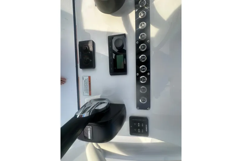 Slide: The Image of Control panel of 2026 Action Craft 22 Bay boat with Yamaha throttle. - 56