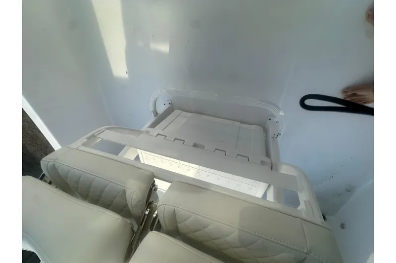 Slide: The Image of Interior view of 2026 Action Craft 22 Bay boat with white seating and deck. - 59