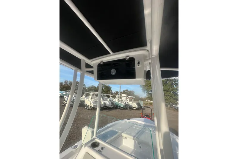 Slide: The Image of 2026 Action Craft 22 Bay boat interior with T-top and console view. - 61