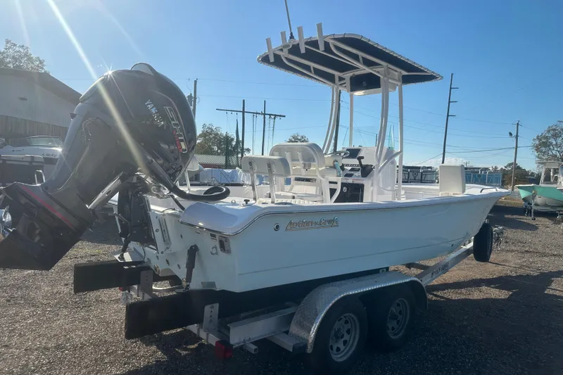 Slide: The Image of 2026 Action Craft 22 Bay boat with Yamaha engine on a trailer, sunny day. - 8