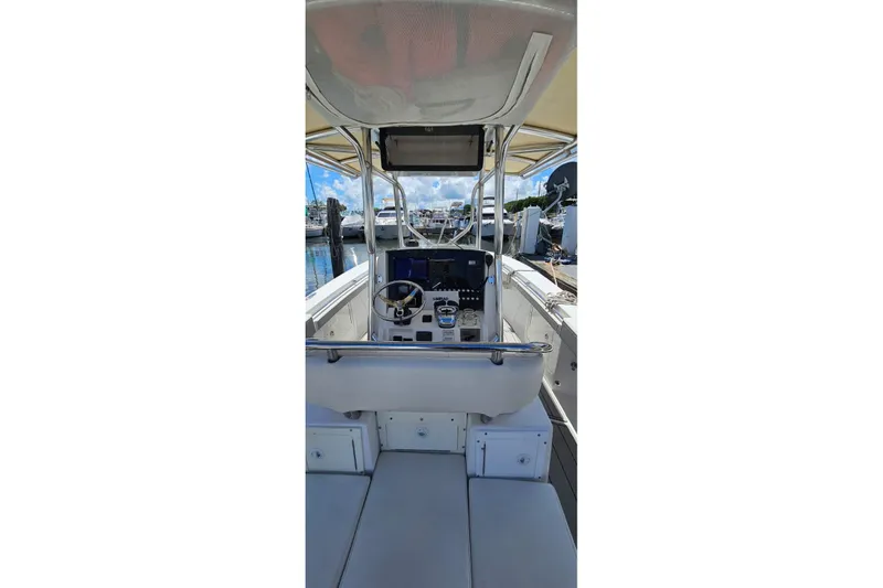 Slide: The Image of 2007 Southport 26 Center Console boat interior with steering wheel and controls. - 8