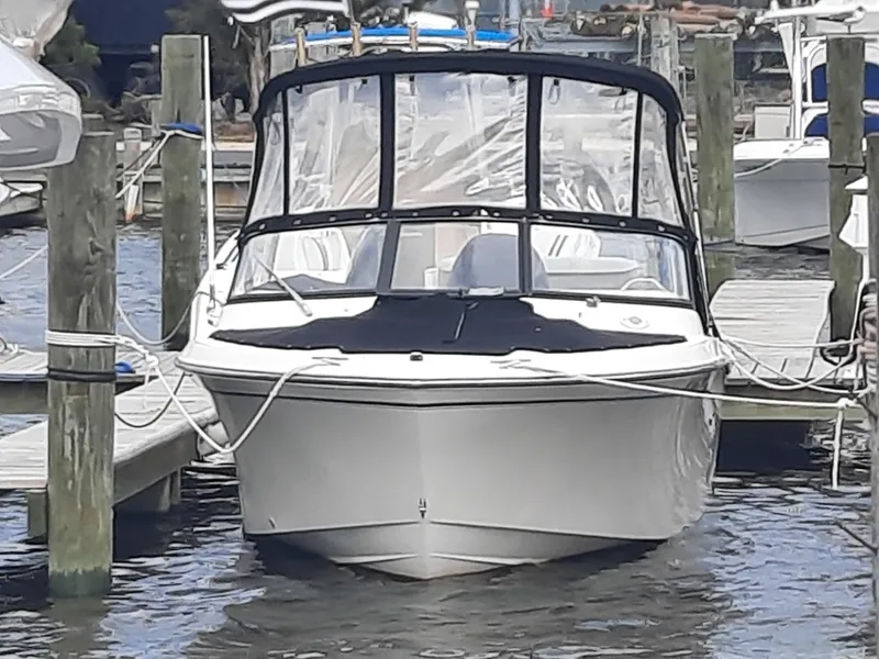 Slide: The Image of 2016 Grady-White Freedom 205 boat docked with protective cover, front view. - 12
