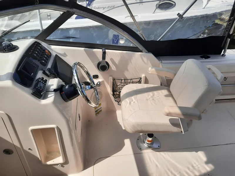 Slide: The Image of 2016 Grady-White Freedom 205 boat interior with steering wheel and captain's chair. - 14