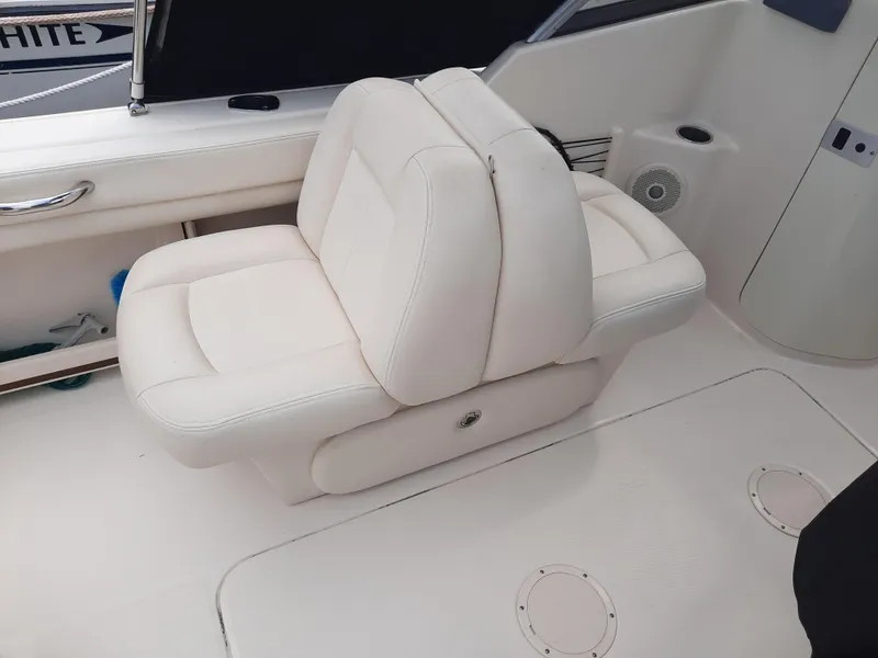 Slide: The Image of 2016 Grady-White Freedom 205 boat interior with white cushioned seating. - 21