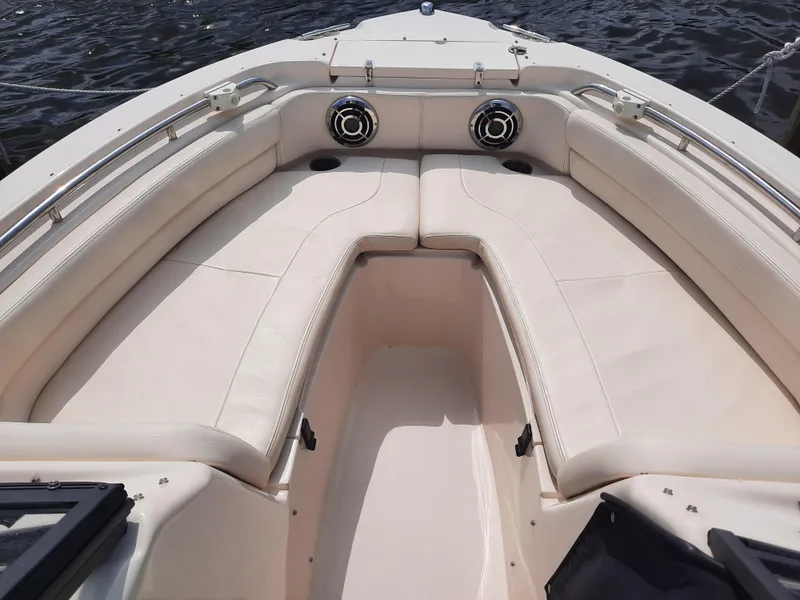 Slide: The Image of 2016 Grady-White Freedom 205 boat interior with cushioned seating and stainless steel fixtures. - 24