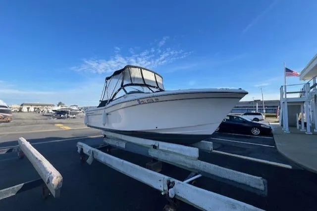 Slide: The Image of 2016 Grady-White Freedom 205 boat on trailer in marina parking lot. - 31
