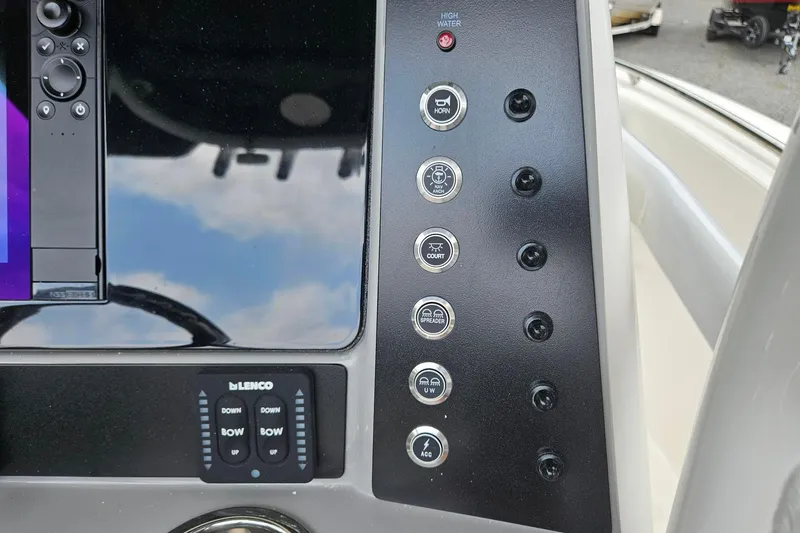 Slide: The Image of Control panel of 2025 Robalo R230 Center Console boat with various function buttons. - 15