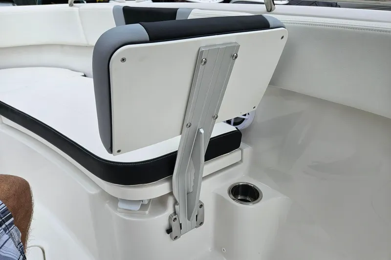 Slide: The Image of 2025 Robalo R230 Center Console boat seat with adjustable backrest and cup holder. - 22