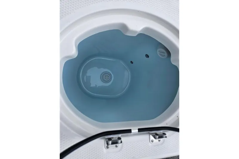 Slide: The Image of Livewell of 2025 Robalo R230 Center Console boat, filled with water. - 30