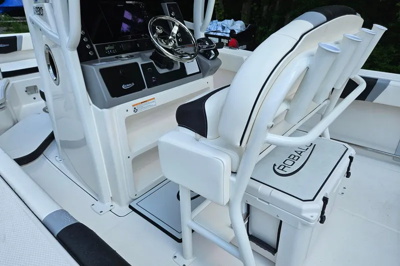 Slide: The Image of 2025 Robalo R230 Center Console boat interior with steering wheel and seating. - 31
