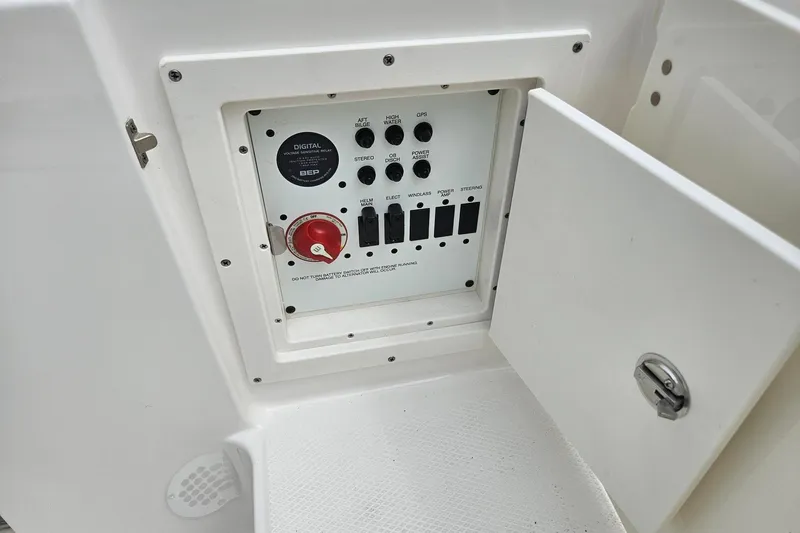 Slide: The Image of Control panel of 2025 Robalo R230 Center Console boat with open access door. - 36
