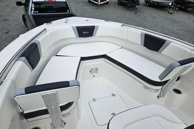 Slide: The Image of 2025 Robalo R230 Center Console boat with spacious seating and modern design. - 4