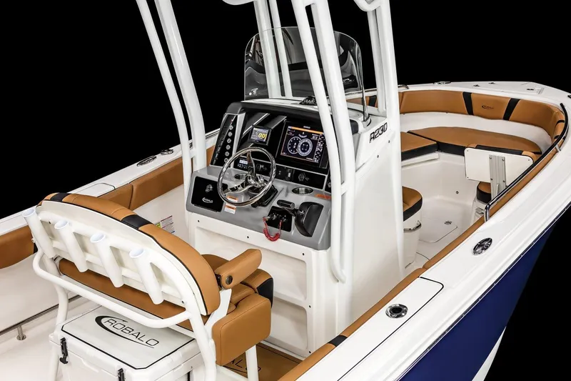 Slide: The Image of Manufacturer Provided Image: 2025 Robalo R230 Center Console boat interior with modern dashboard and seating. - 45