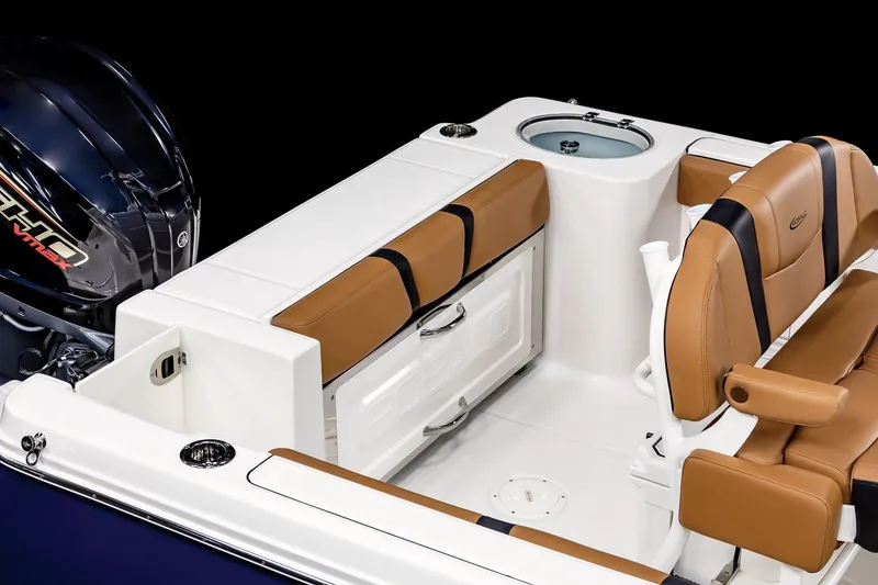 Slide: The Image of Manufacturer Provided Image: 2025 Robalo R230 Center Console boat interior with tan seating and storage compartments. - 47