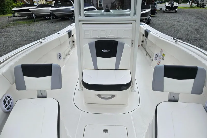 Slide: The Image of 2025 Robalo R230 Center Console boat interior with stylish seating and modern design. - 7
