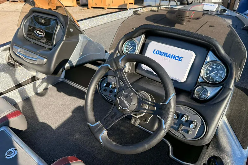 Slide: The Image of Lowrance device on 2026 Triton 179 TrX boat deck, sunny day. - 11