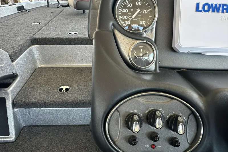 Slide: The Image of 2026 Triton 179 TrX boat dashboard with gauges and control switches. - 17