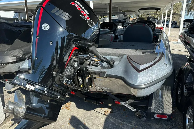 Slide: The Image of 2026 Triton 179 TrX boat with Mercury Pro XS engine, parked on a trailer. - 30