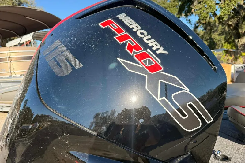 Slide: The Image of Mercury Pro XS 115 outboard motor on 2026 Triton 179 TrX boat, close-up view. - 31