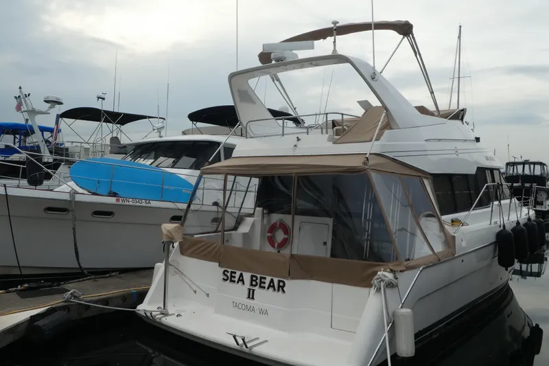 The Image of 1994 Bayliner 4388 Motor Yacht docked at marina, rear view. - 0