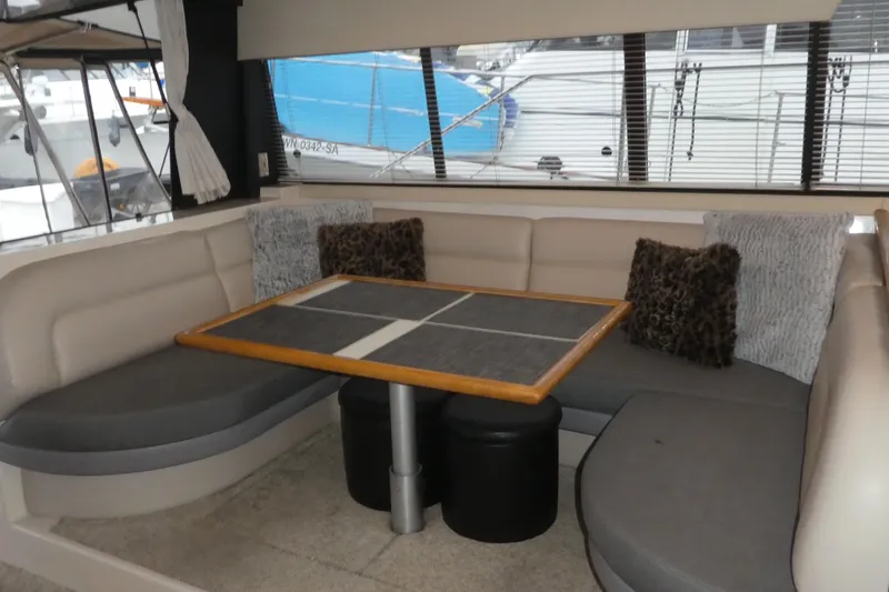 Slide: The Image of Interior of 1994 Bayliner 4388 Motor Yacht with cozy seating and table. - 14