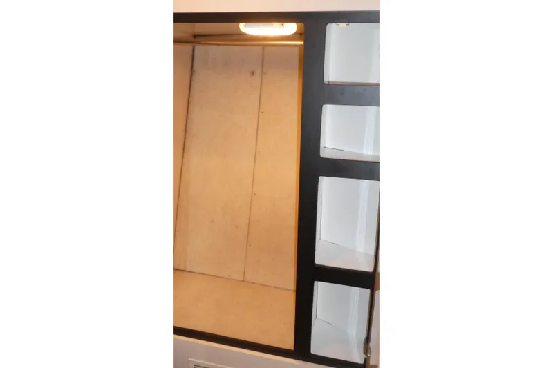 Slide: The Image of Interior shelving of 1994 Bayliner 4388 Motor Yacht with built-in lighting. - 24