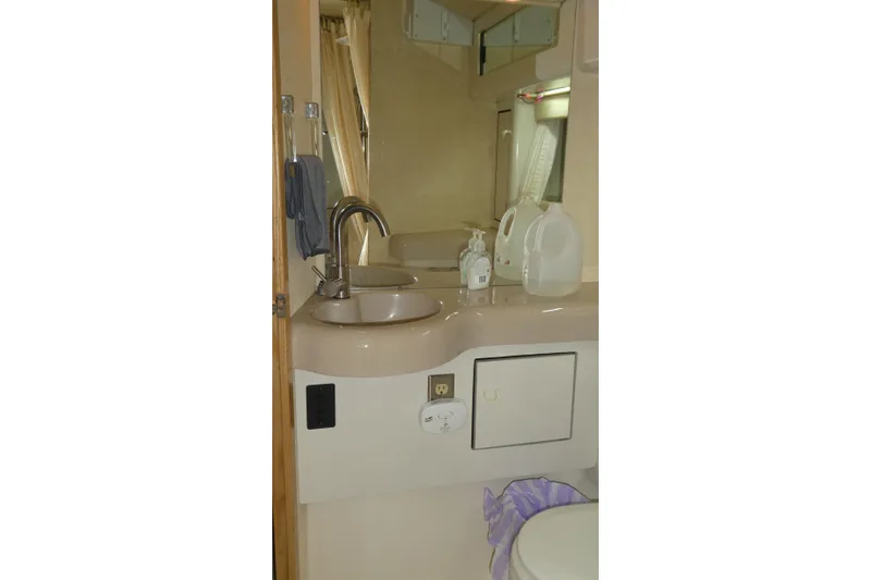 Slide: The Image of Bathroom interior of 1994 Bayliner 4388 Motor Yacht with sink and mirror. - 28