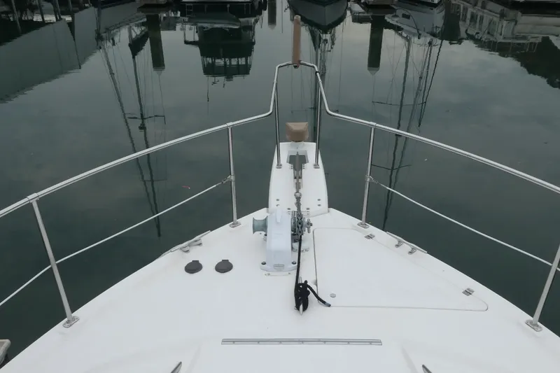 Slide: The Image of Bow view of 1994 Bayliner 4388 Motor Yacht docked in marina. - 3