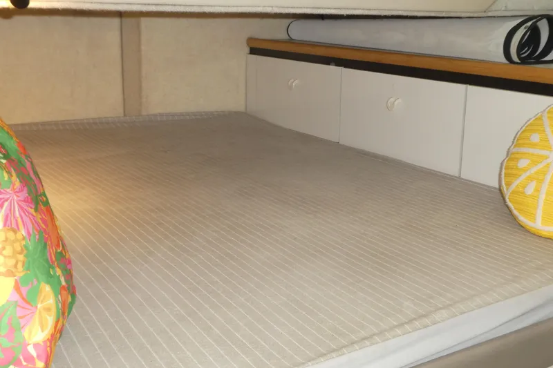 Slide: The Image of Cozy cabin interior of 1994 Bayliner 4388 Motor Yacht with colorful pillows. - 32