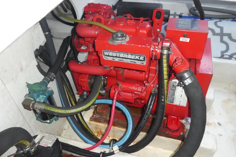 Slide: The Image of Engine compartment of a 1994 Bayliner 4388 Motor Yacht with red Westerbeke generator. - 35