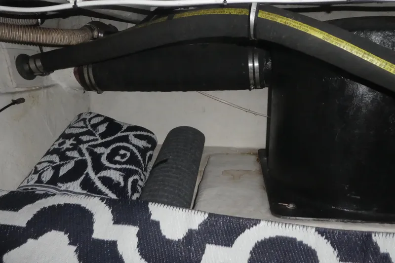 Slide: The Image of Engine compartment of 1994 Bayliner 4388 Motor Yacht with hoses and patterned mats. - 37