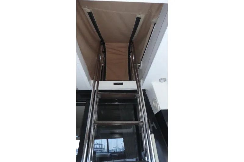 Slide: The Image of Stainless steel ladder inside 1994 Bayliner 4388 Motor Yacht, leading to upper deck. - 39