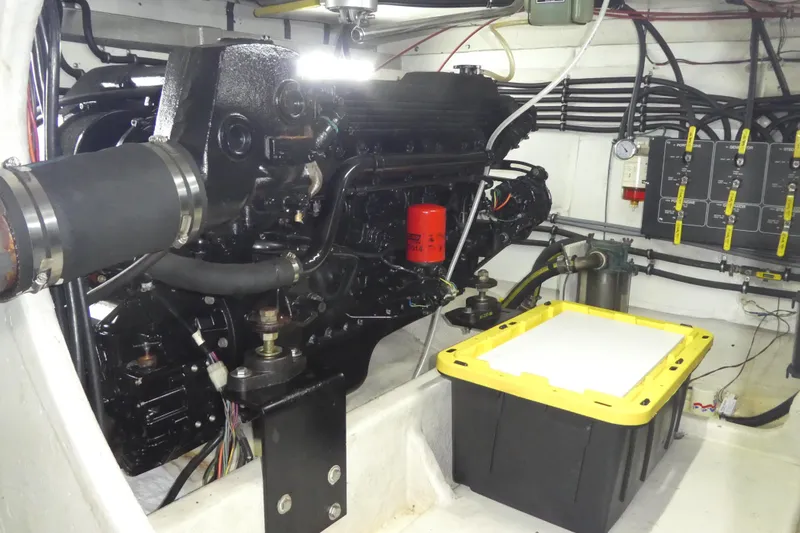 Slide: The Image of Engine room of 1994 Bayliner 4388 Motor Yacht with visible components and wiring. - 48