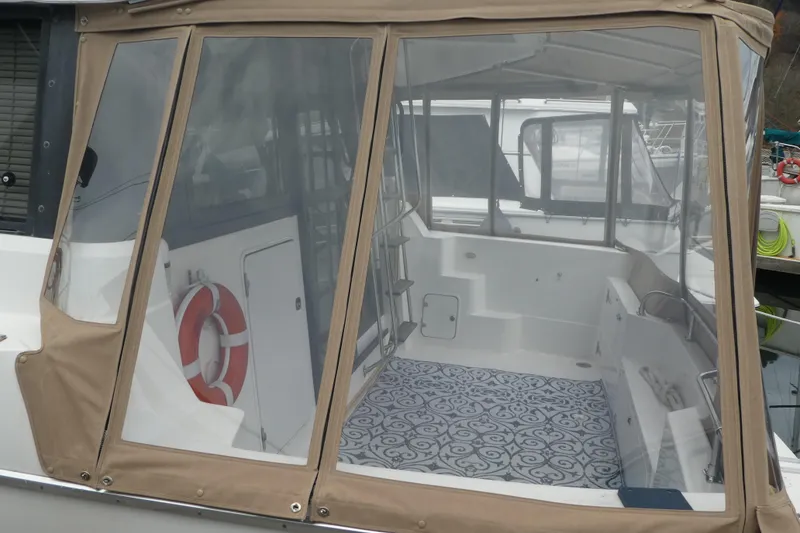 Slide: The Image of 1994 Bayliner 4388 Motor Yacht with enclosed deck and patterned flooring. - 5