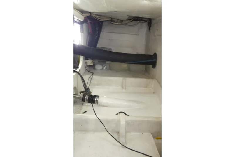 Slide: The Image of Engine compartment of 1994 Bayliner 4388 Motor Yacht, showing hoses and wiring. - 51