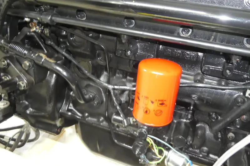 Slide: The Image of Engine of 1994 Bayliner 4388 Motor Yacht with visible orange oil filter. - 56