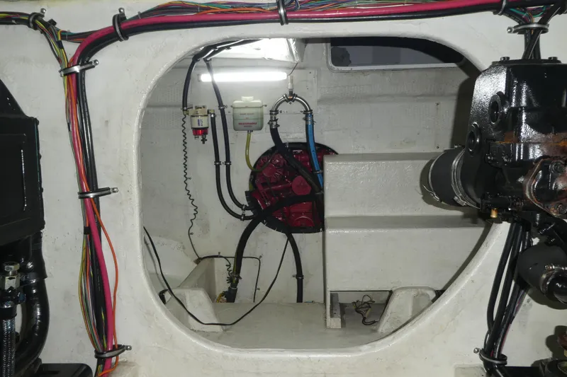 Slide: The Image of Engine room of 1994 Bayliner 4388 Motor Yacht with visible wiring and components. - 57