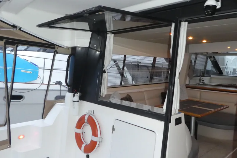 Slide: The Image of Interior view of 1994 Bayliner 4388 Motor Yacht with seating and table. - 9