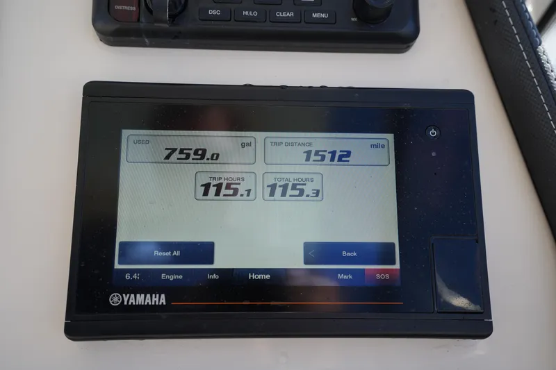 Slide: The Image of Yamaha display on 2022 Grady-White Freedom 235 showing fuel usage and trip data. - 24