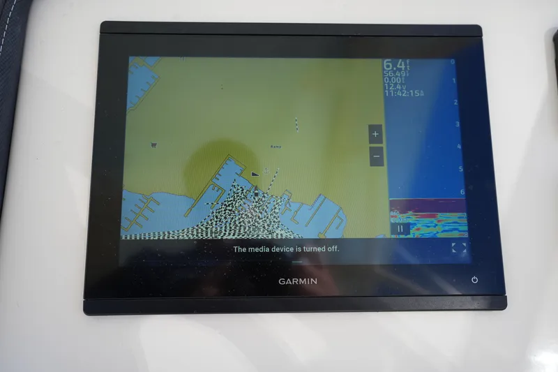 Slide: The Image of Garmin marine GPS display on 2022 Grady-White Freedom 235 boat dashboard. - 25