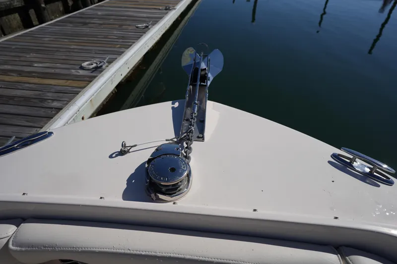 Slide: The Image of Bow of 2022 Grady-White Freedom 235 boat docked at marina. - 30