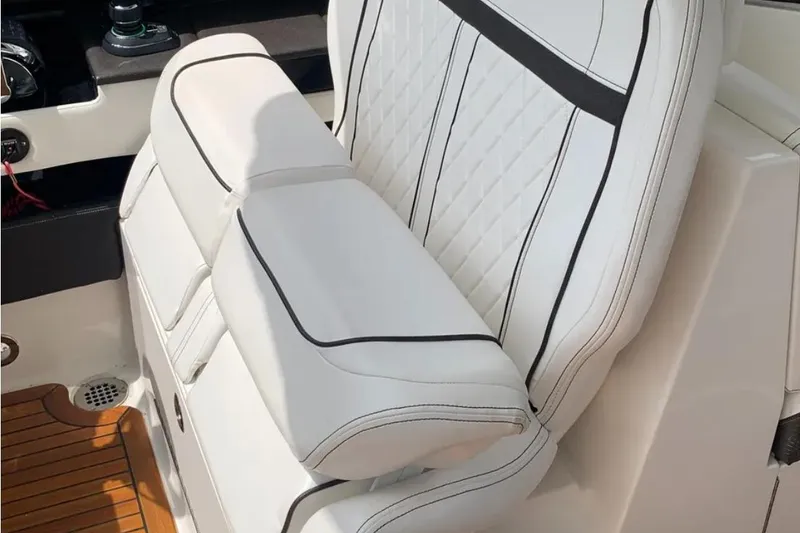 Slide: The Image of Luxurious white seating on 2018 Sea Ray SLX 310 boat with elegant stitching. - 10