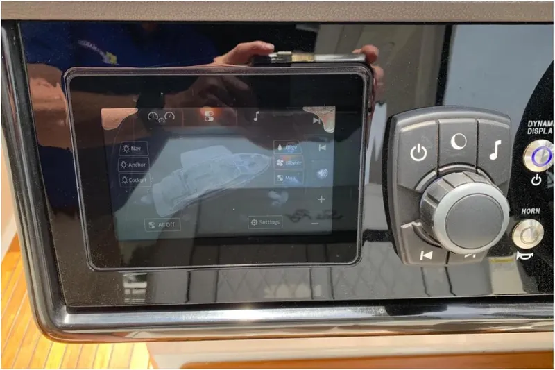 Slide: The Image of 2018 Sea Ray SLX 310 control panel with touchscreen and navigation controls. - 15