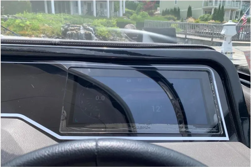 Slide: The Image of Dashboard of a 2018 Sea Ray SLX 310 boat with digital display. - 16