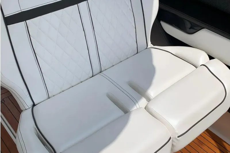 Slide: The Image of Luxurious white seating on 2018 Sea Ray SLX 310 boat with elegant stitching. - 18