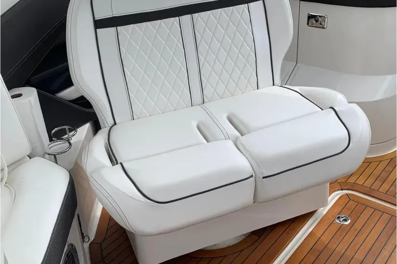 Slide: The Image of Luxurious white seating on 2018 Sea Ray SLX 310 boat with elegant stitching. - 20