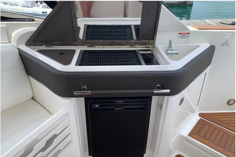Slide: The Image of 2018 Sea Ray SLX 310 boat kitchenette with grill and sink. - 22